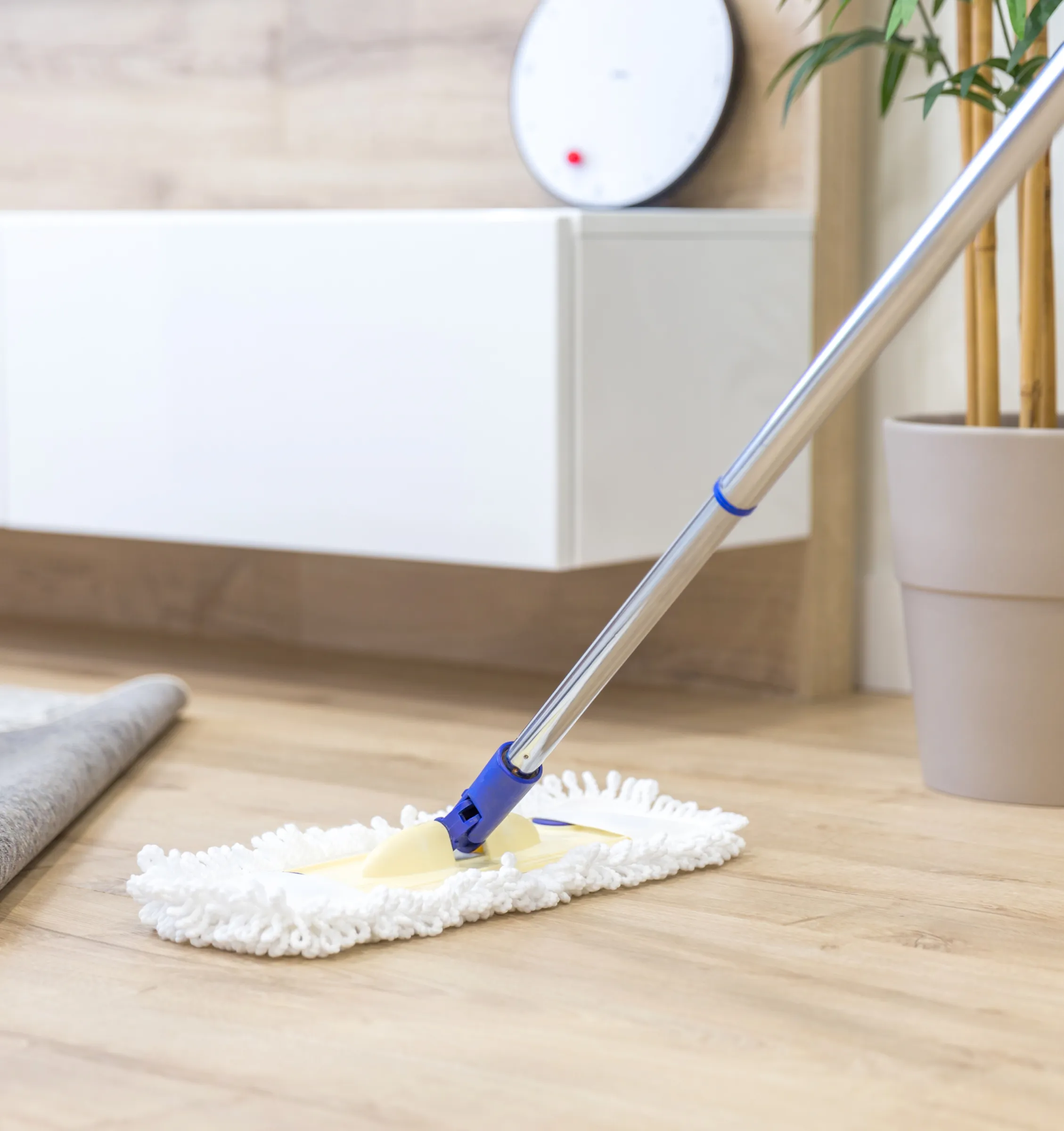 Mop in use on wood floor